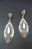Silver and Marcasite Stones Earrings with Mother of Pearl protracted drop and details on the sides. 6cm