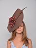 Headdress Amalia. Made of Brown Sisal and Decorated with a Flower and a Feather 74.380€ #94004AMALIA