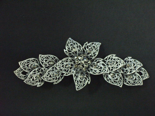 Silver and marcasita brooch,in the shape of a flower and leaves